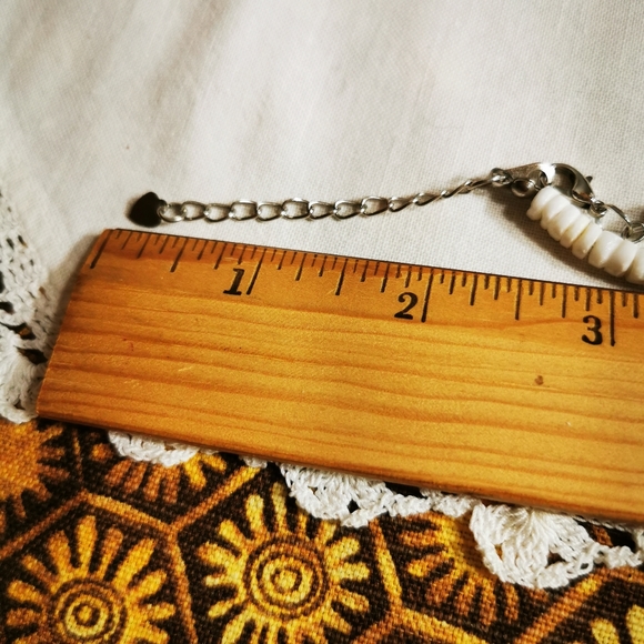 Puka Shell and Plumeria Flower Necklace - Picture 14 of 15